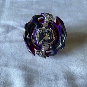 Purple and Silver Spinning Top Beyblade